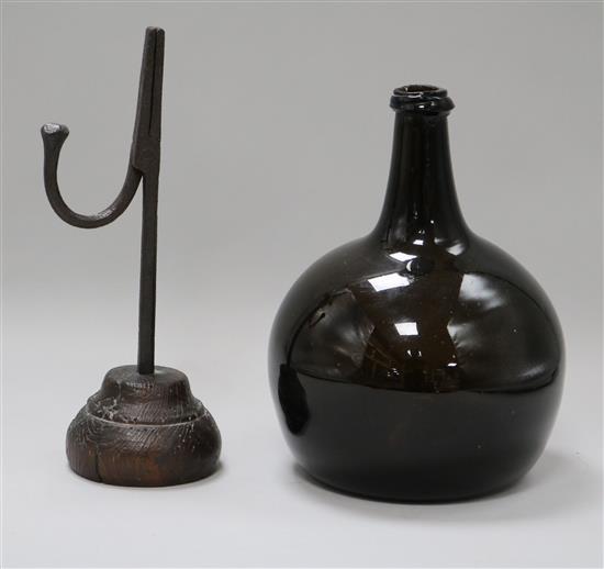 An 18th century rush light and early Dutch bottle rush light 24cm